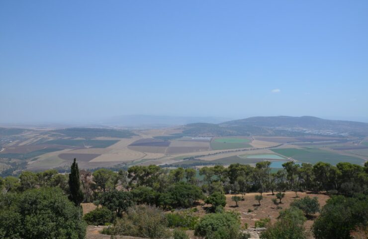 a view of the countryside from the top of a hill